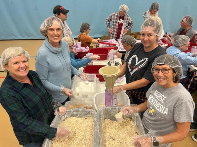 Volunteers packing meals