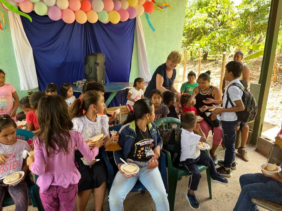Children being fed on a mission trip